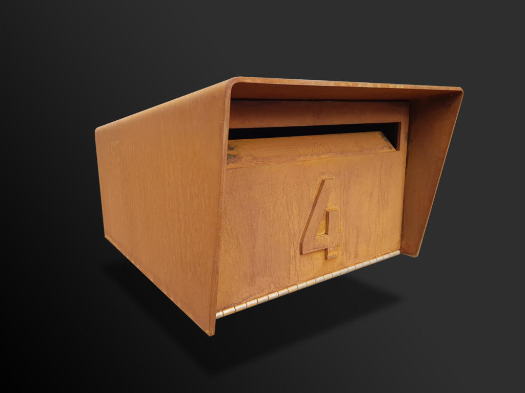 A modern take on a traditional style letterbox; Letterbox made from corten steel with a natural rusted finish