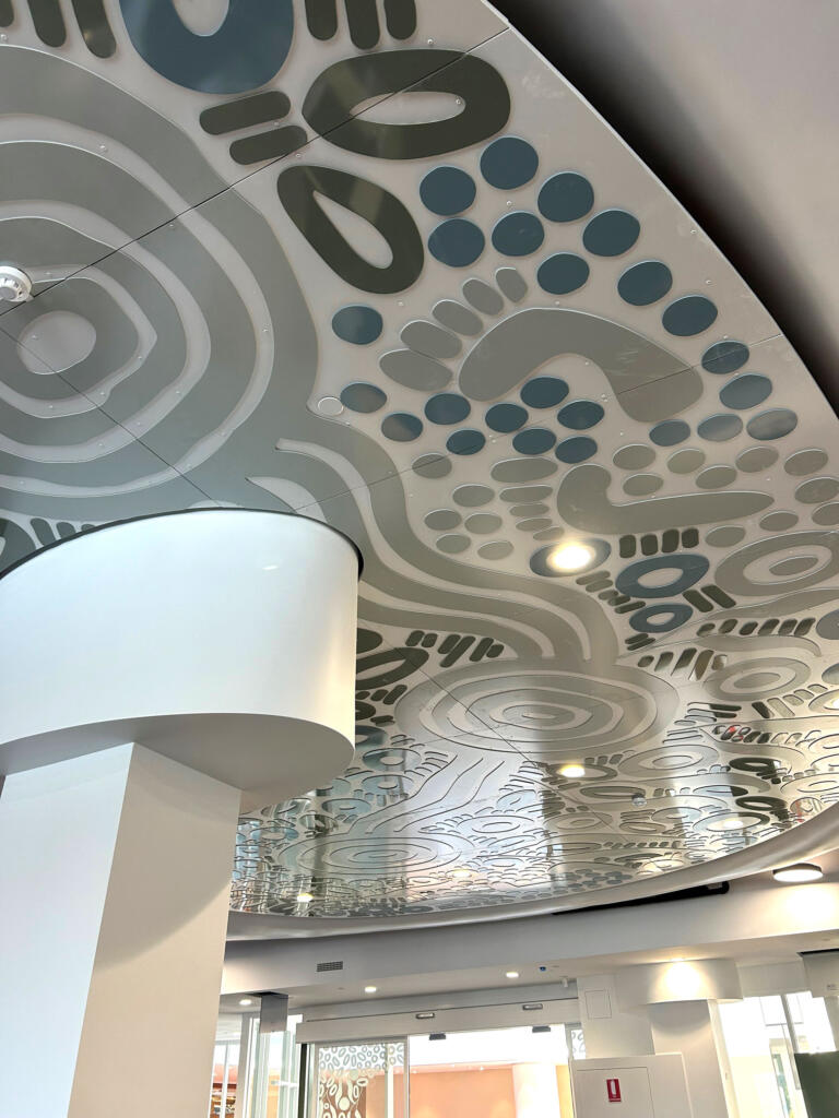 Artwork by Kamara Morgan featured in Knox Library fabricated by Lump Sculpture Studio; First Nations artwork installed on the ceiling of the new Knox Library;